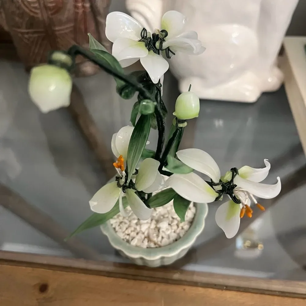 Vintage jade quartz tree in celadon pot. White and Green Plant.